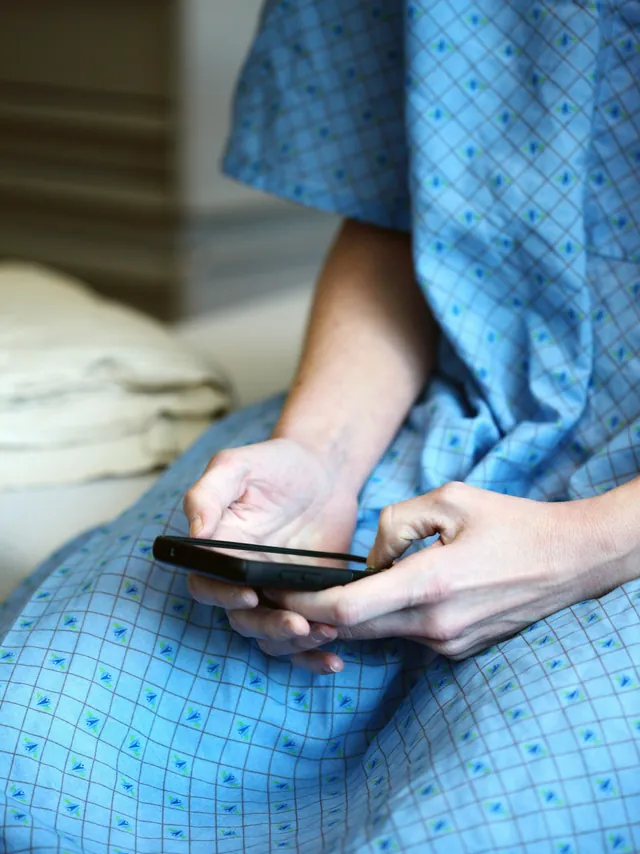 Someone looking something up on a phone in hospital