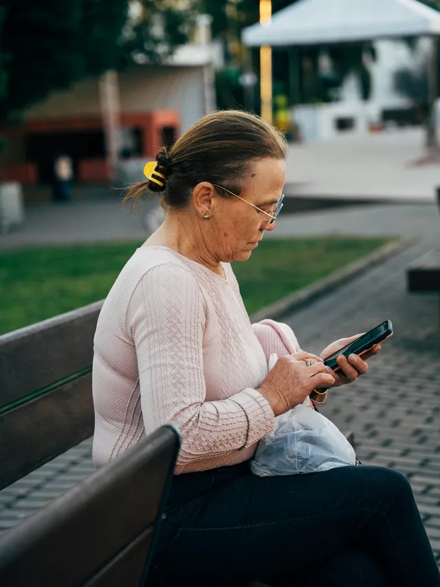 Someone reading their service&rsquo;s information on a phone